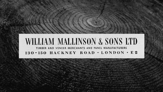 Black and white image of a wooden texture with a sign for William Mallinson & Sons Ltd.
